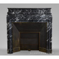 Antique Louis style fireplace mantel with acroterion